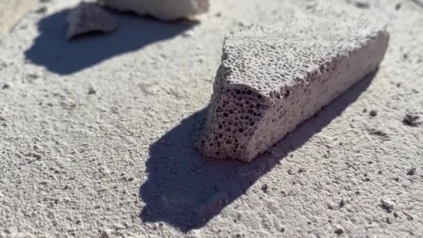 Video Footage Male Builder Removing Pieces Foam Block Cut Strobe — Stockvideo