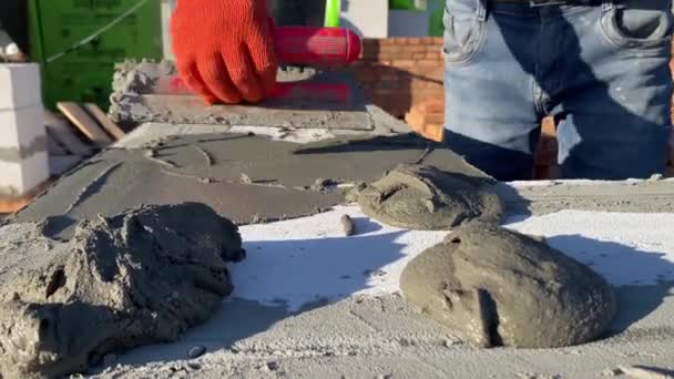 Male Builder Lays Foam Block Special Mortar Laying Blocks Outer — Stock video