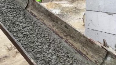 Pouring concrete mix on concreting form work. Forming, an essential part of the entire building process. Before concrete can be poured, forms need to be built to hold the concrete in place. Slow