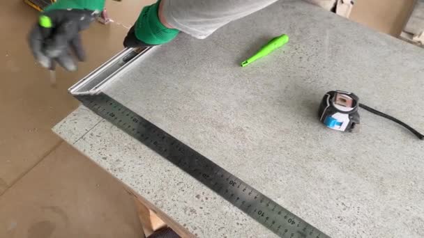 Video Footage Taking Measurements Further Cutting Tiles Using Diamond Cutter — Stockvideo