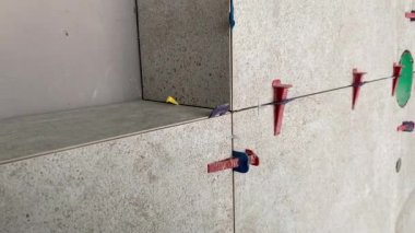 Tiling work. 4k video footage of the finished wall after tiling in a large bathroom