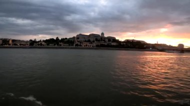 4k video footage of a river walk along the Danube in Budapest at sunset, Hungary. Sailing on a pleasure boat in the river