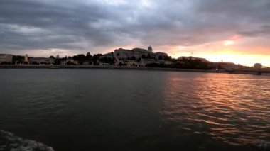 4k video footage of a river walk along the Danube in Budapest at sunset, Hungary. Sailing on a pleasure boat in the river