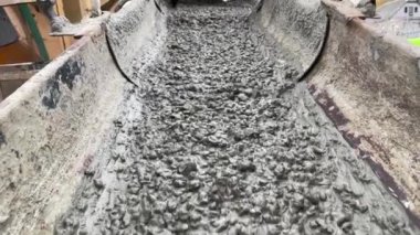 Pouring concrete mix on concreting form work. Forming, an essential part of the entire building process. Before concrete can be poured, forms need to be built to hold the concrete in place. Slow