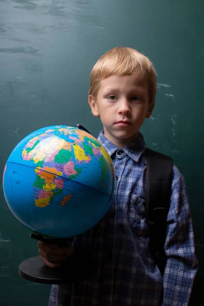 stock image Caucasian preschool boy holding globe, copy space