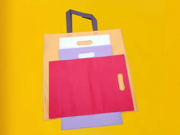 Beautiful Non Woven Grocery Shopping Bag with yellow background. Tote ECO Bags