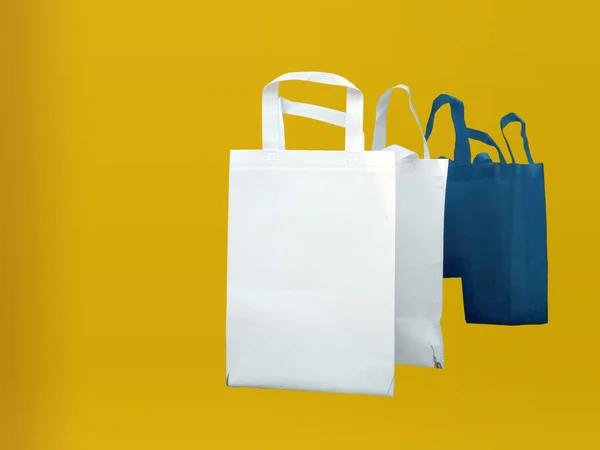 Beautiful Non Woven Grocery Shopping Bag with yellow background. Tote ECO Bags