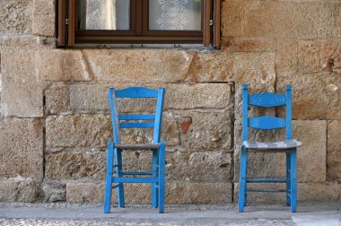 Traditional Greek taverna blue chairs, Crete island