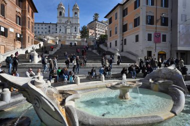 Rome, Italy - February 17, 2022:  View of Spanish steps and Fontana della Barcaccia in Rome, Italy