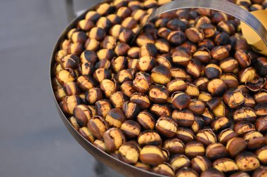 Roasted Chestnuts at Roma city street. Street Food