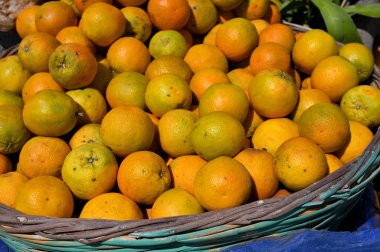 Orange fruits - large amounts of orange fruits, fresh orange fruits, orange fruits in a basket, Greece
