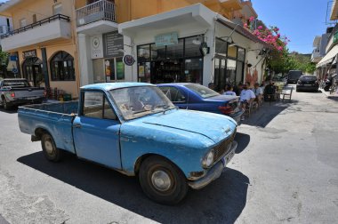 Paleochora, August 6, 2022: Old blue pick-up car at old town street in Paleochora, Crete island, Greece