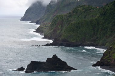 View of the rocks of the island of Madeira in the Atlantic Ocean. Rainy day at Madeira
