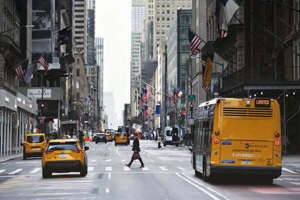 New York City - February 16, 2023: Traffic on street in Manhattan, New York City, United States
