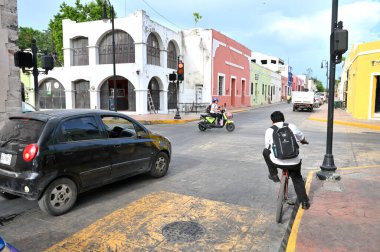 Mexico, Valladolid - july 19, 2023: Unidentified people on a colorful narrow street in the center of Valladolid, Yucatan, Mexico clipart