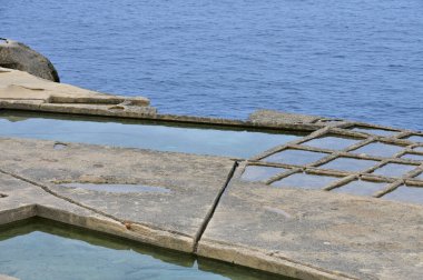 Salt evaporation ponds on Gozo island Malta clipart