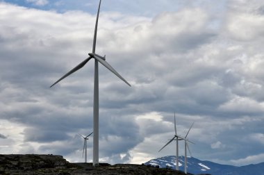 Wind turbines in the wind park located in the central part of Norway clipart