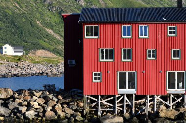 Norway., Nyksund Village - August 09, 2023. red house in the typical Norwegian fishing village - Nyksund, on Langoya island. clipart