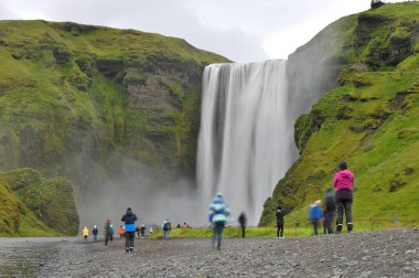 Iceland - August 02, 2024: Unknown people visiting large waterfall in East Iceland. clipart