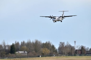 Lithuania, Vilnius, - April 08, 2025: OH-ATL FINNAIR ATR 72 airplane landing in Vilnius airport, Lithuania.