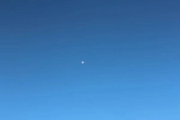 moon and a blue sky