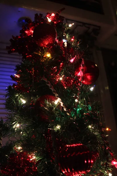 christmas tree with lights and ornaments.
