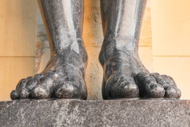 Granite stone statues of Atlantes at the entrance to the new Hermitage in the northern capital of Russia, St. Petersburg. A famous tourist attraction all over the world. The place is often rented in