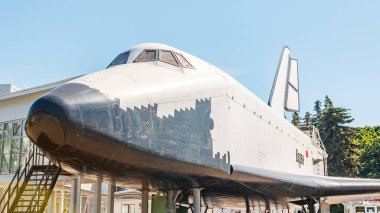 MOSCOW, RUSSIA - JUNE 17, 2021: Exhibition exhibit of Buran spacecraft at the All-Russian Exhibition of Achievements of the Peoples of the USSR VDNKh. Near the Transport pavilion