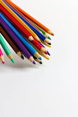 Multicolored art pencils on a white background. For professional artists, crafters, handmade. Production of paintings, drawings and children's creativity.