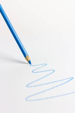 Multicolored art pencils on a white background. For professional artists, crafters, handmade. Production of paintings, drawings and children's creativity.