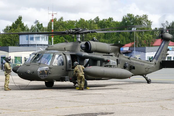 stock image Liepaja, Latvia - August 7, 2022: US Army Sikorsky UH-60 Black Hawk military helicopter with crew after landing at the airport during the Baltic International Air Show