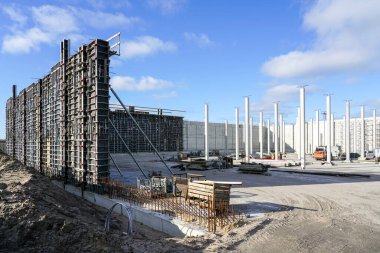 Construction site of a huge reservoir for the drinking water export terminal using concrete formwork with a folding mechanism