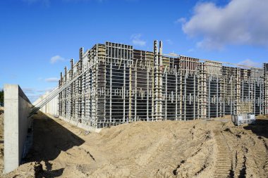 Construction site of a huge reservoir for the drinking water export terminal using concrete formwork with a folding mechanism