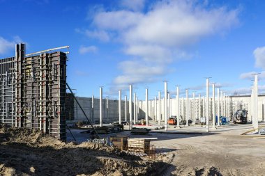 Construction site of a huge reservoir for the drinking water export terminal using concrete formwork with a folding mechanism