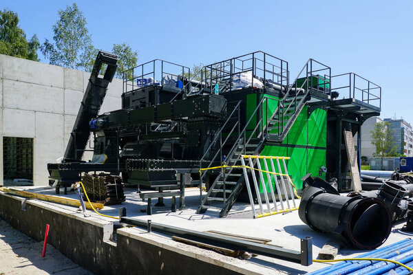 New modern unfinished wood chip biofuel boiler house for increased heat energy production efficiency from renewable energy resources