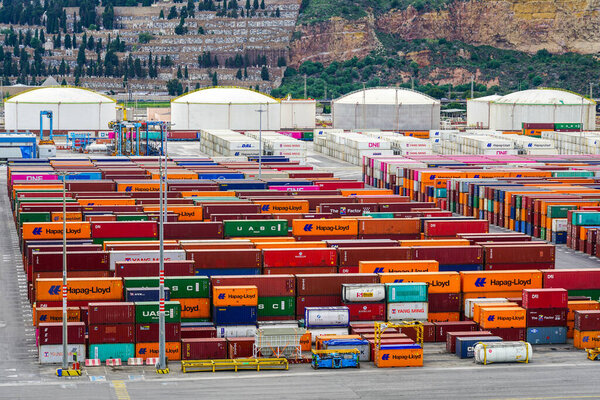 Barcelona, Spain- May 25, 2024: industrial landscape with many sea containers and gas tanks at port area