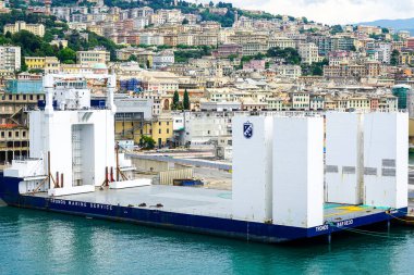 Genoa, Italy- May 27, 2024: Tronds Marine Service semi-submersible heavy load carrier cargo barge Tronds Barge 33, IMO 8977948 clipart