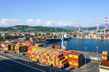 La Spezia, Italy - May 28, 2024: Aerial view of container freight terminal of the Spezia seaport, global container shipping logistics industry clipart