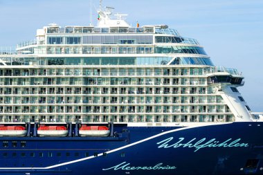 Civitavecchia, Italy- May 29, 2024: cruise liner Mein Schiff 2 side view with multi story balconies with passengers clipart