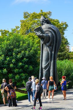 Split, Croatia - September 20, 2024: Tourists in the front of the bronze statue of bishop Gregory of Nin in the Giardin park in Split, Croatia clipart