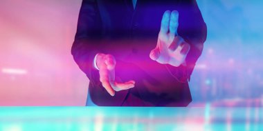 Modern virtual digital technologies. A man in a suit touches a digital virtual screen. 