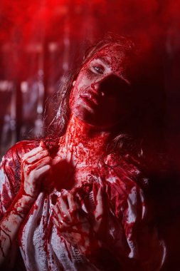 Spooky portrait of a poor innocent girl drenched in blood standing weak in a dark gloomy castle. Horror, thriller. Halloween. Vampires. clipart