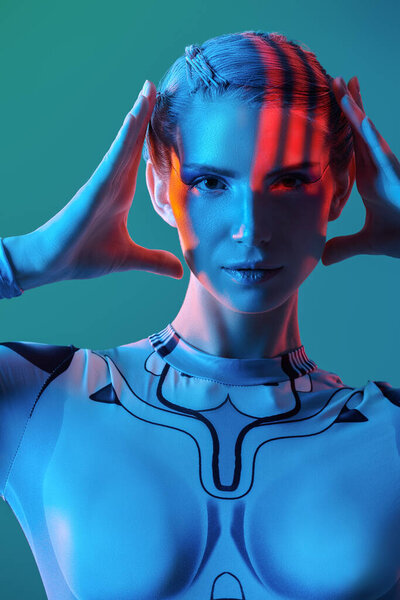 Cyberpunk concept. Portrait of a perfect cyber girl in a tech suit posing in mixed colored neon light. Futuristic tech style.