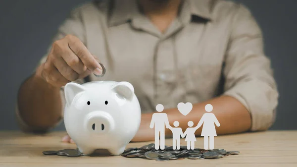 Man Putting Coin Piggy Bank Icon Family Wood Table Donation — Fotografia de Stock