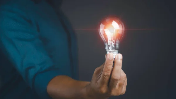 Man Holding Illuminated Light Bulb Shine Glitter Idea Innovation Inspiration — Stock Photo, Image
