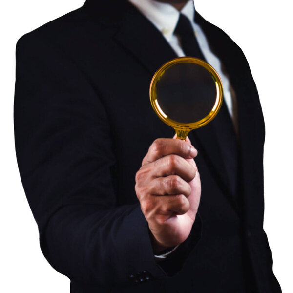 Businessman using magnifying glass isolated on white background.