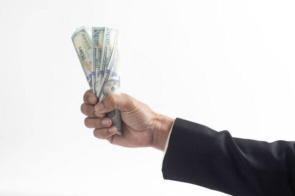 Доллары в руках бизнесмена на белом фоне.