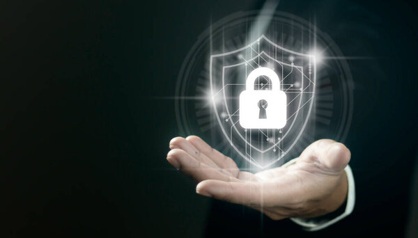 Businessman hold shield icon. Data protection and insurance Business security concepts.