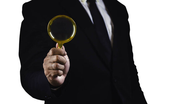Businessman using magnifying glass isolated on white background with empty space.