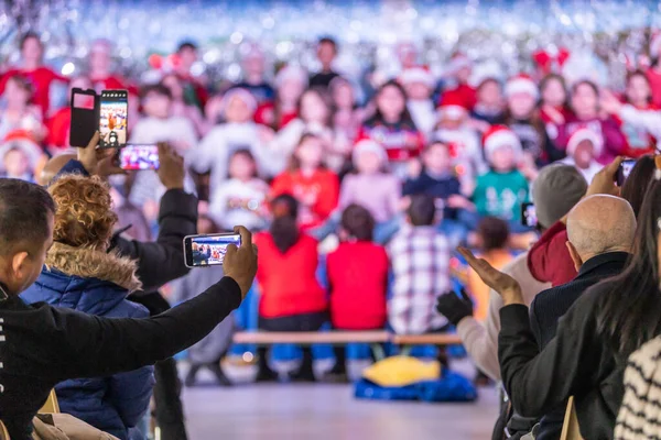 Families Enjoying Christmas Festival Children School Father Videotaping His Phone — Stock Photo, Image